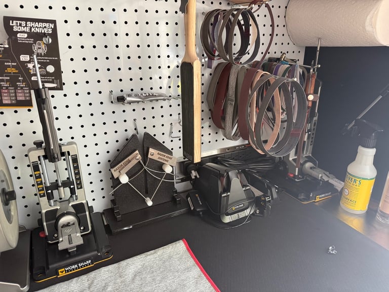 Workbench display with pegboard showing tools, sanders, hanging bicycle wheels, and supplies in a workshop or retail setting