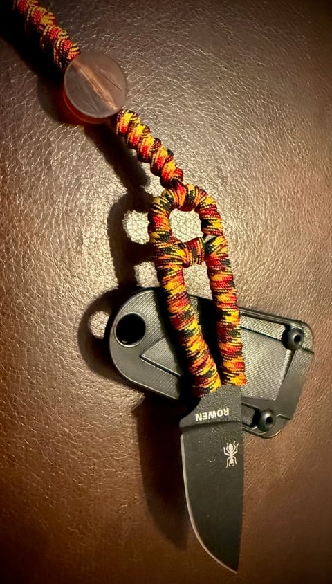 ESEE Izula with custom Oktoberfest paracord wrapped handle and trident bead