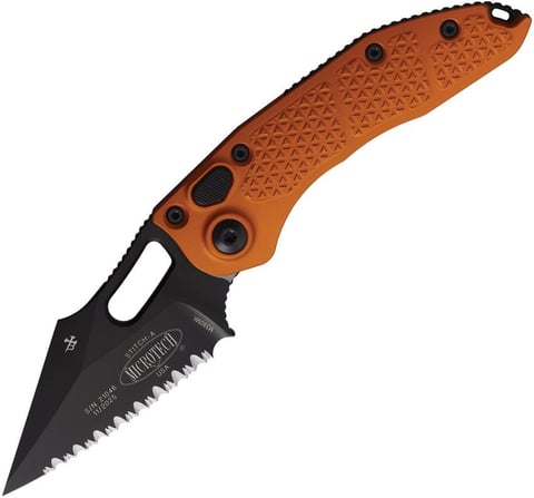 Orange and black serrated folding knife with textured handle against white background