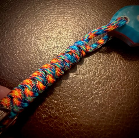 Cudeman Pyrana pocket knife with custom paracord lanyard and Spartan helmet bead
