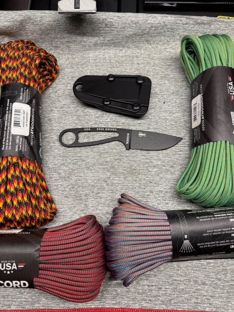 ESEE Izula with custom Oktoberfest paracord wrapped handle and trident bead