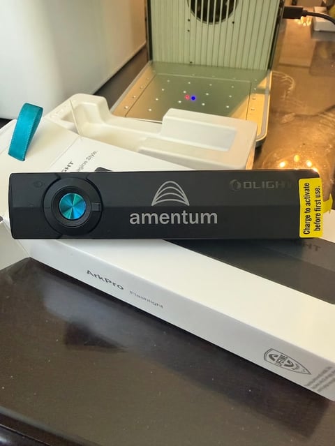 Amentum Oblique laser projector device with blue dial